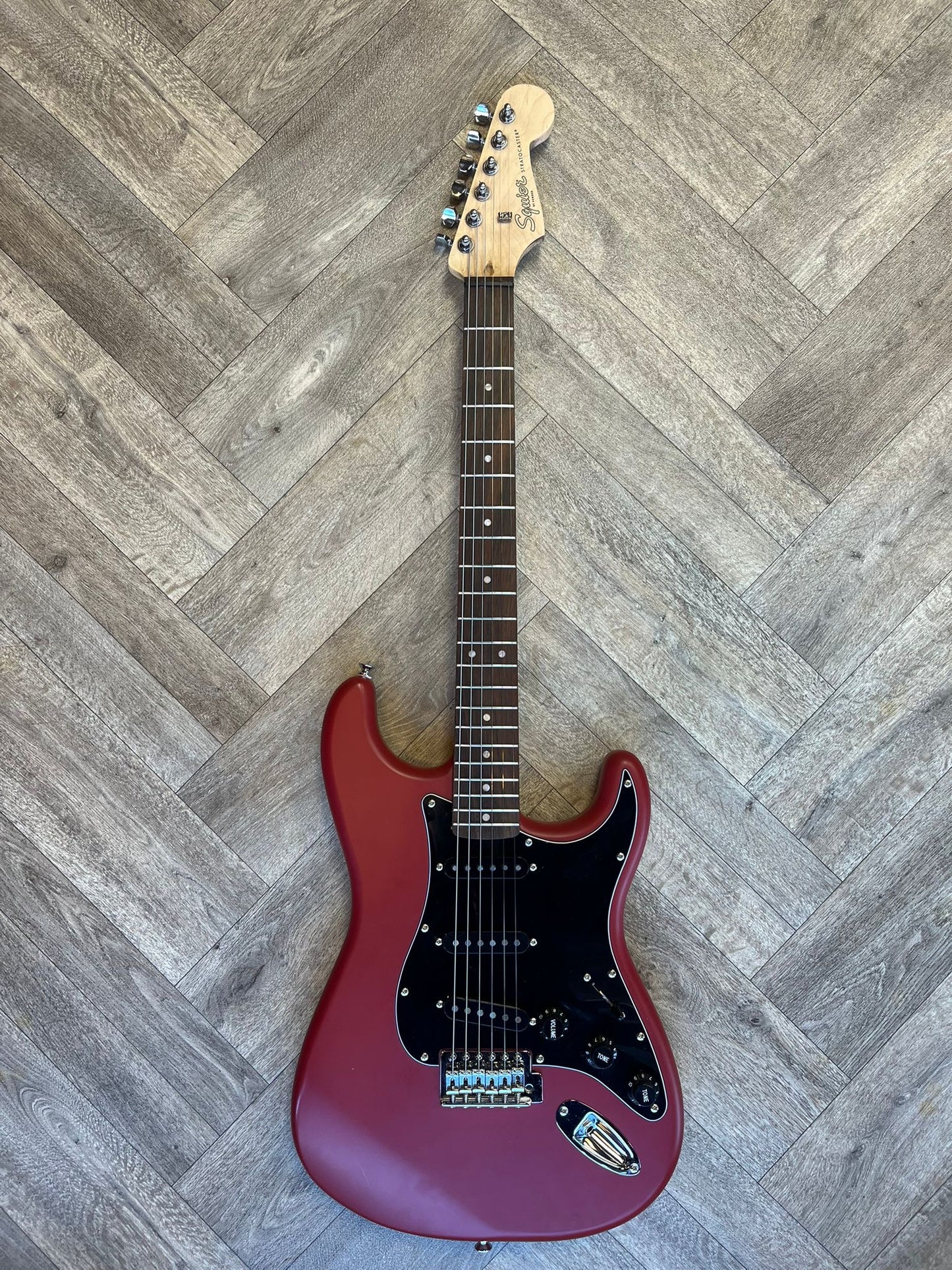 Modified Squier Stratocaster in Cherry Red with Black pickguard