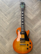 Electric guitar on a wooden floor