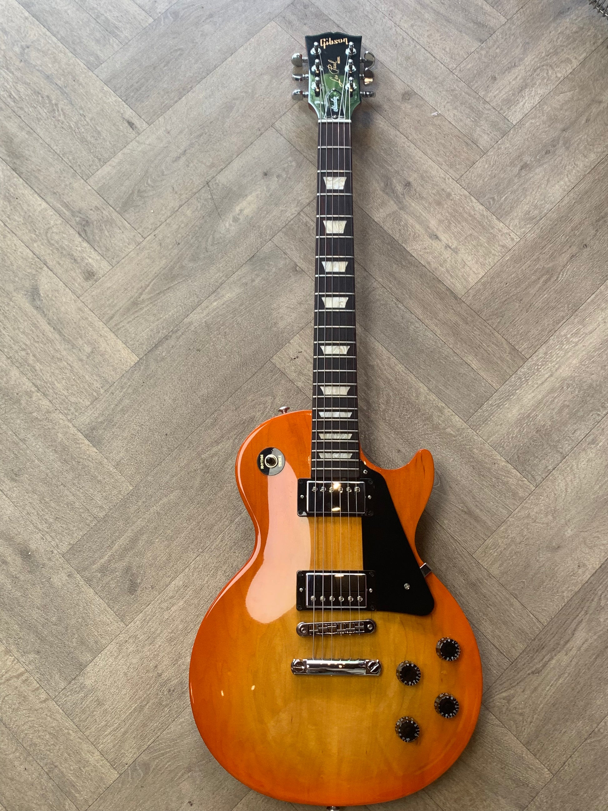 Electric guitar on a wooden floor