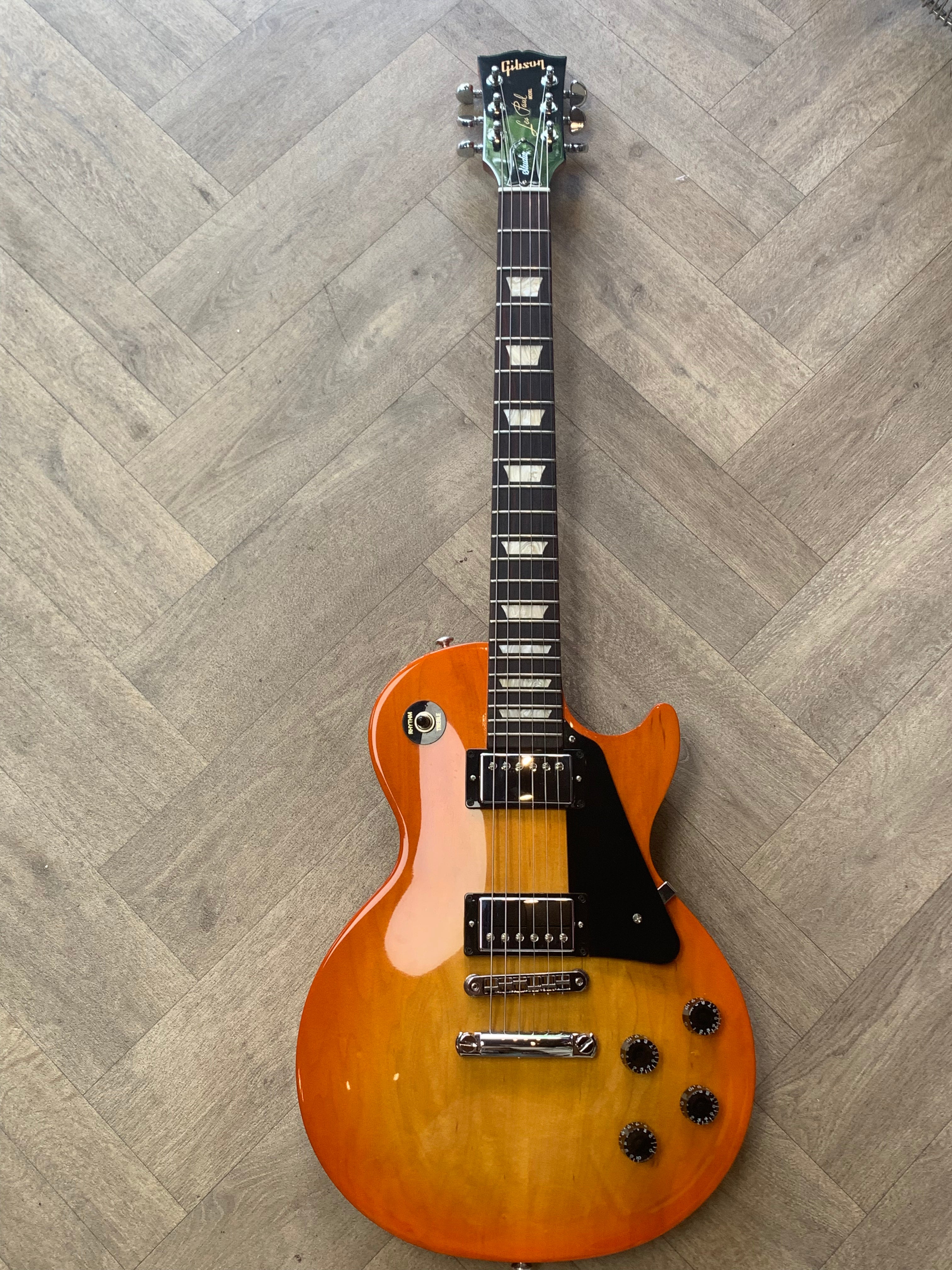 Electric guitar on a wooden floor