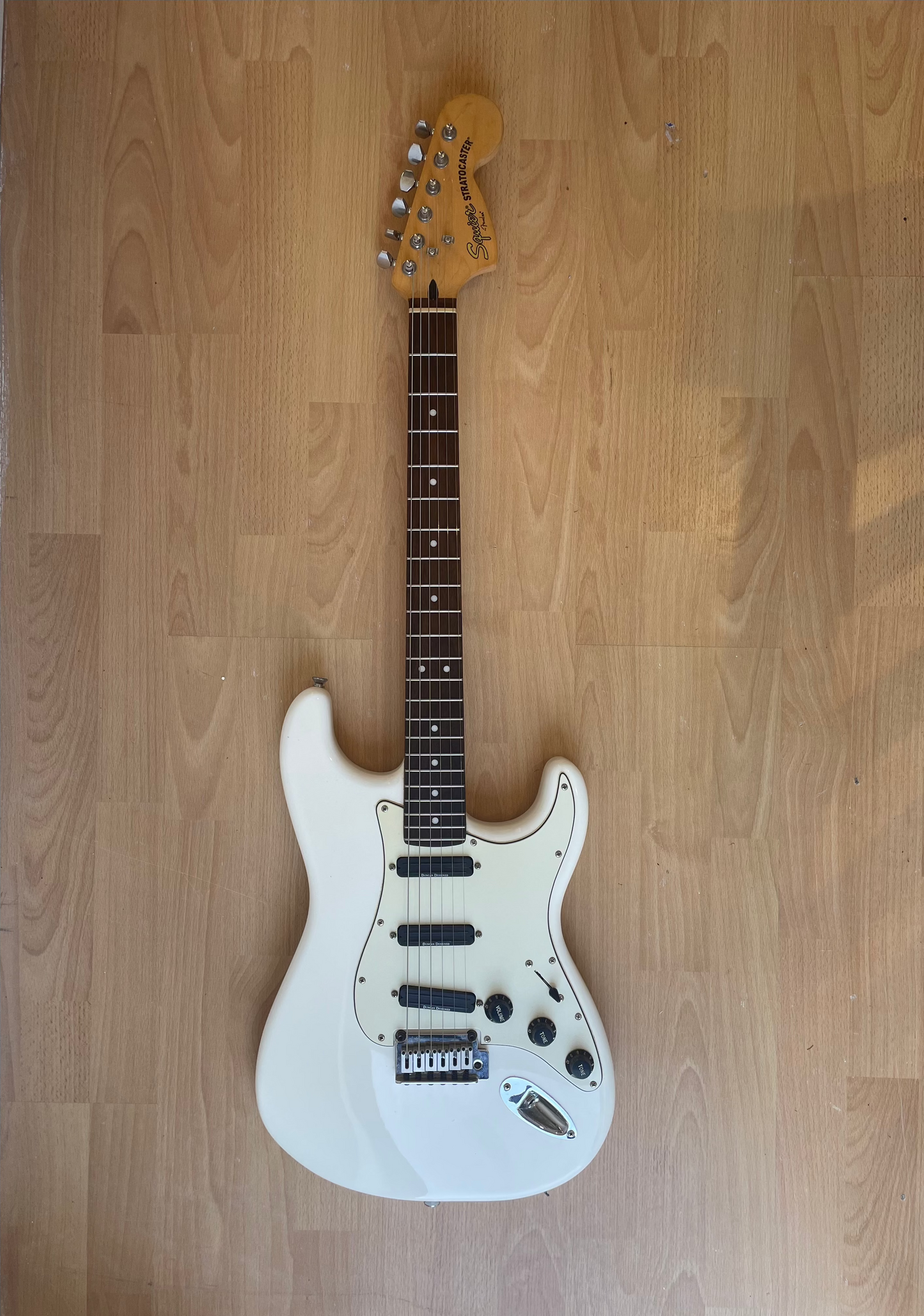 Beautful White Squier Strat modified with Seymour Duncan Pickups