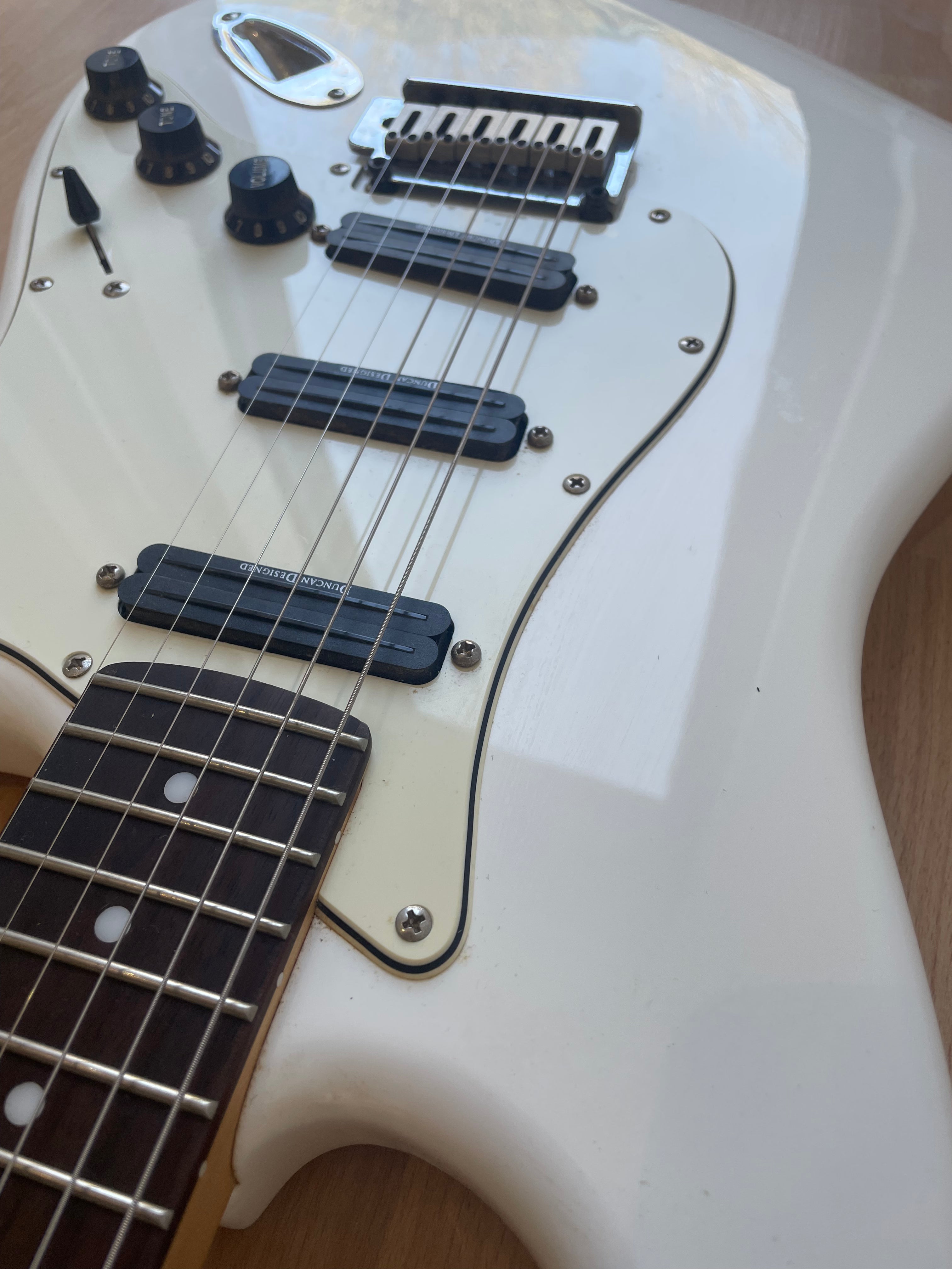 Beautful White Squier Strat modified with Seymour Duncan Pickups