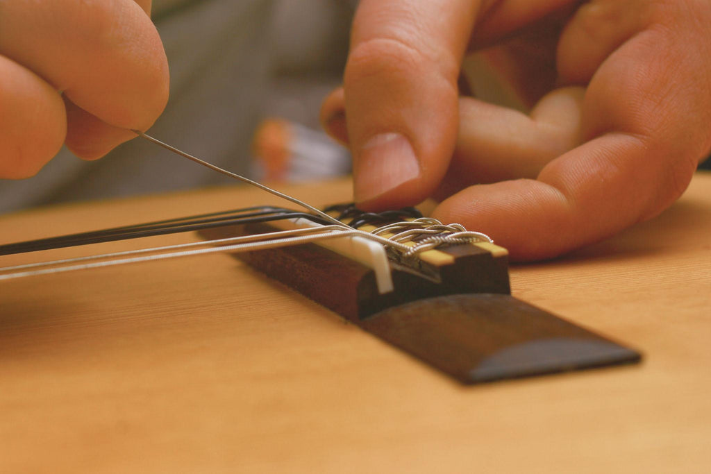 Student Guitar String Change – £20